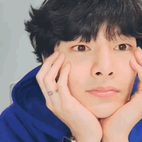 Young Man With Hands on Face