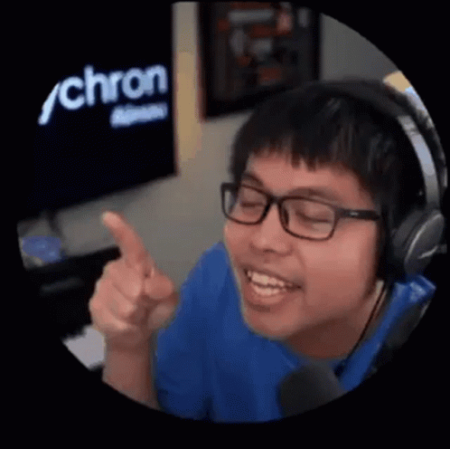 Young Man With Headphones and Glasses Pointing