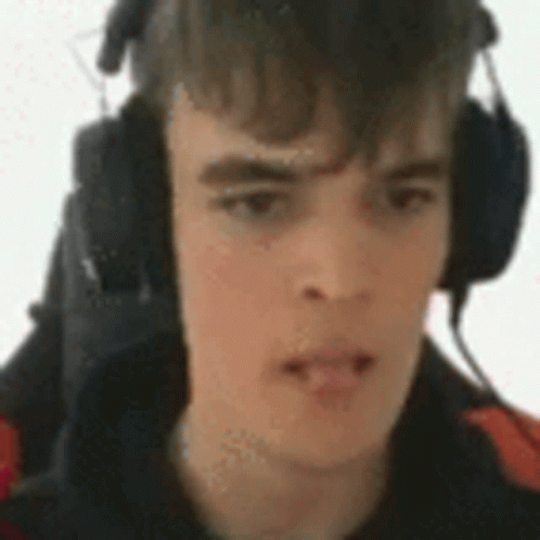 Young Man With Headphones and Microphone Funny Face