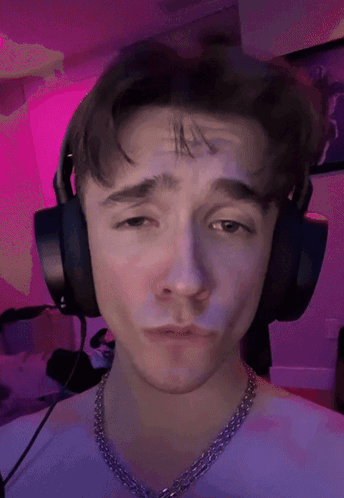 Young Man With Headphones and Purple Chain