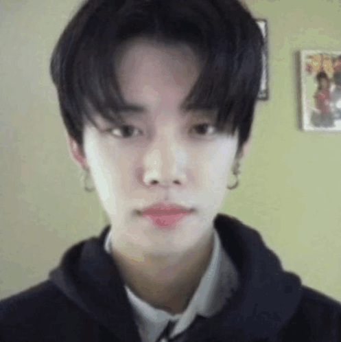 Young Man With Hoodie and Earrings