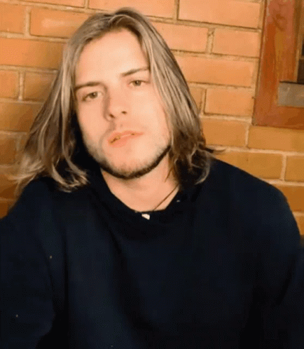 Young Man With Long Blonde Hair and Beard
