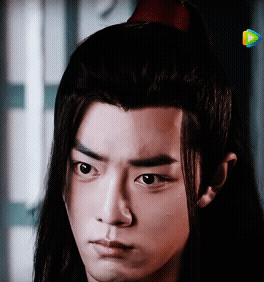 Young Man with Long Hair Close Up