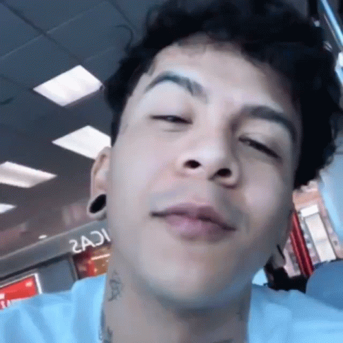 Young Man With Neck Tattoo Close Up