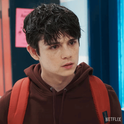 Young Man with Netflix Hoodie and Red Backpack