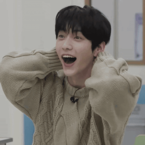 Young Man With Open Mouth In Tan Sweater GIF