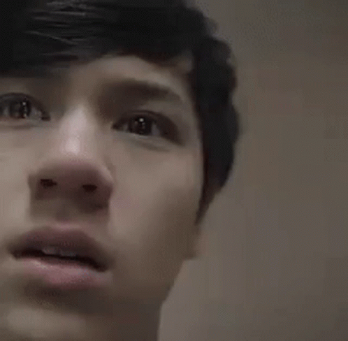 Young Man With Open Mouth Looking At Camera GIF