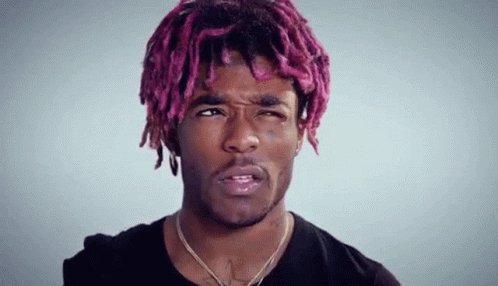 Young Man with Pink Hair and Dreadlocks Making Face