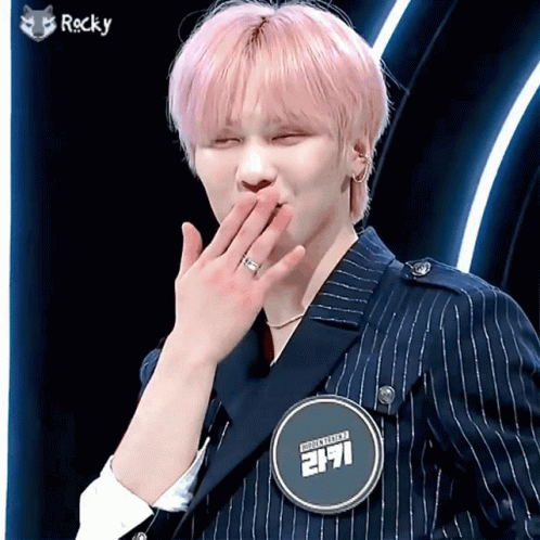 Young Man With Pink Hair And Rocky Badge GIF
