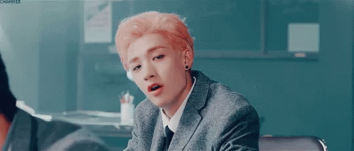 Young Man With Pink Hair in Suit and Tie