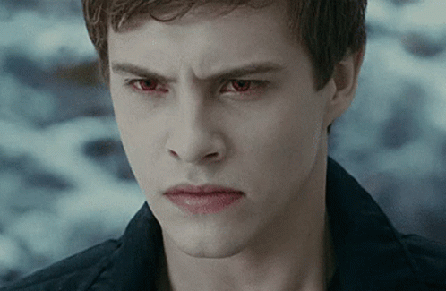 Young Man With Red Eyes Looking at Camera