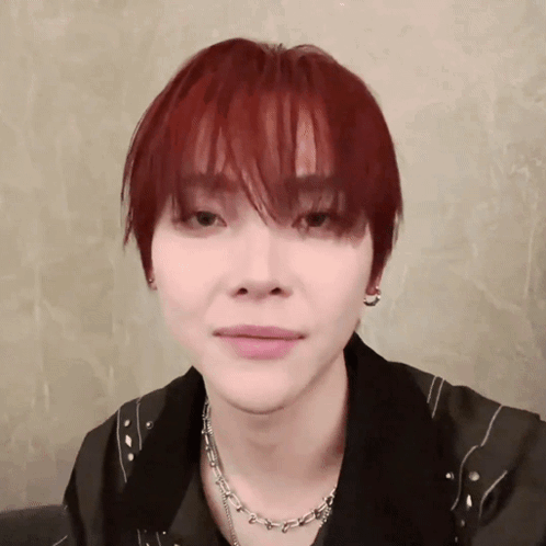 Young Man With Red Hair and Necklace