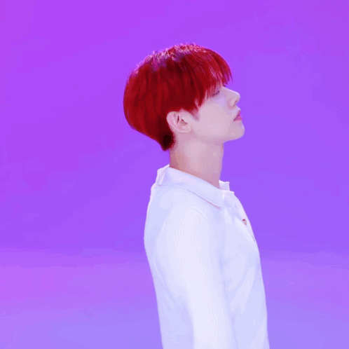 Young Man With Red Hair and White Shirt