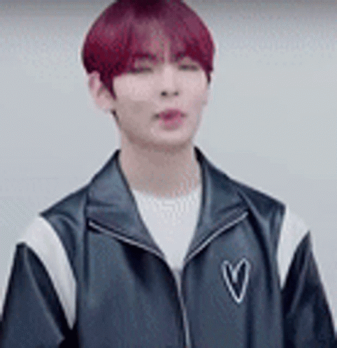 Young Man With Red Hair In Black Jacket With Heart GIF