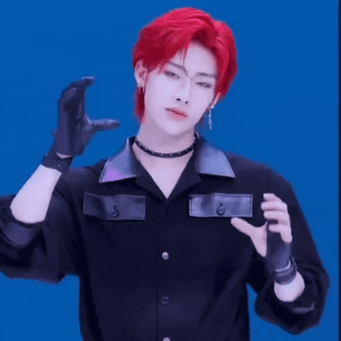 Young Man With Red Hair in Black Shirt and Gloves