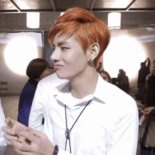 Young Man with Red Hair in White Shirt