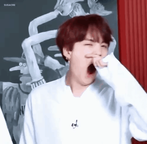 Young Man With Red Hair Yawning
