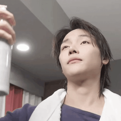 Young Man With Spray Bottle GIF