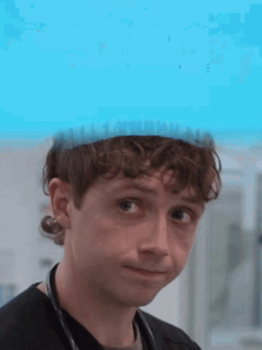 Young Man With Stethoscope and Blue Hat