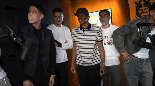Young Men At Microphones Wearing It La Riot Shirt GIF