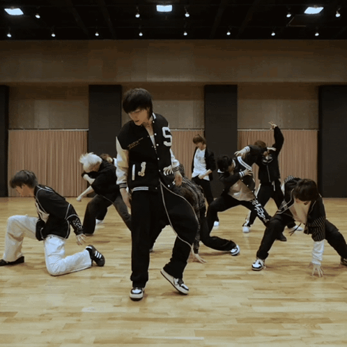 Young Men Dancing With Number 13 on Jacket