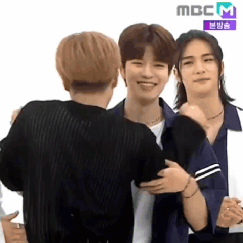 Young Men Hugging And Smiling GIF