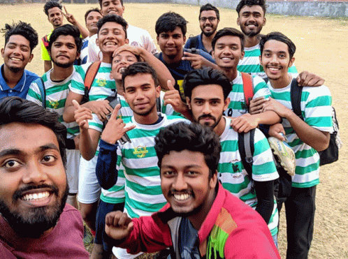 Young Men in Green and White Striped Shirts Taking Selfie