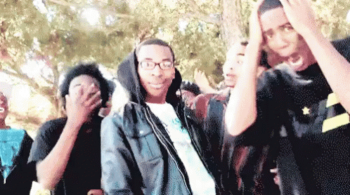 Young Men In Line One With Glasses And Hoodie GIF