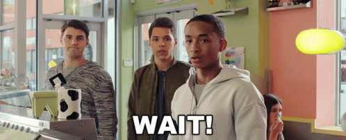 Young Men In Store Saying Wait GIF