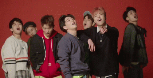 Young Men Laughing On Red Background GIF