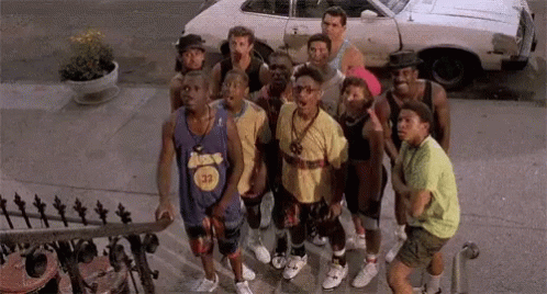 Young Men on Sidewalk by White Car