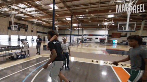 Young Men Playing Basketball