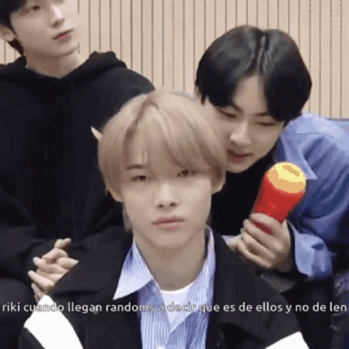 Young Men Posing For Picture With Red Object GIF