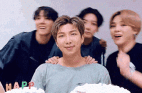 Young Men Posing With Cake Saying Happ