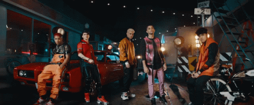Young Men Posing With Red Car GIF
