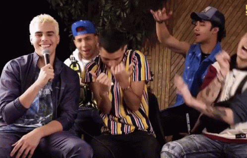 Young Men Sitting At Microphone One In Striped Shirt GIF