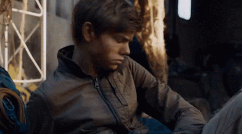 Young Men Sitting In Front Of Wall Saying Clevver GIF