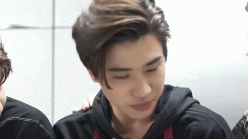 Young Men Sitting Together GIF