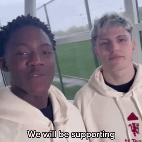 Young Men Standing Next to Each Other