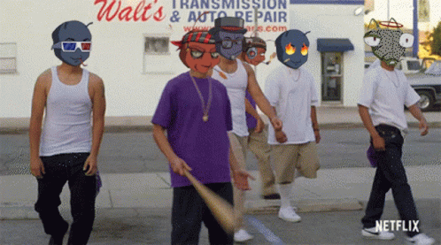 Young Men Walking In Front Of Walt's Transmission & Auto Repair Store GIF