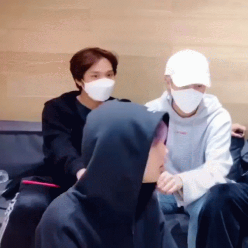 Young Men Wearing Masks Sitting Couch GIF