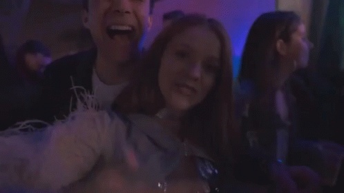 Young People Dancing in Dark Room