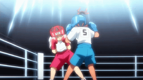 Young Woman in Boxing Gloves in Boxing Ring