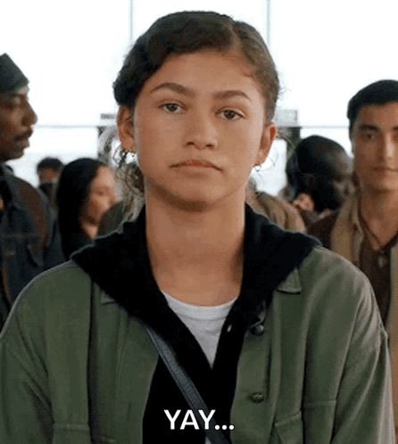 Young Woman In Green Jacket Making Funny Face GIF