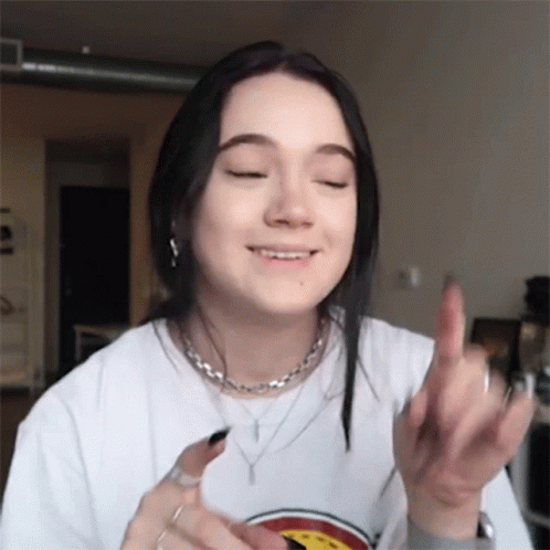 Young Woman In White T-Shirt Giving Middle Finger GIF
