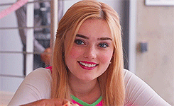 Young Woman Smiling and Eating Pizza