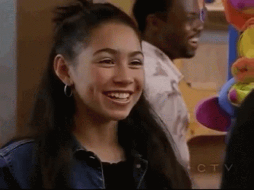 Young Woman Smiling Next to Man