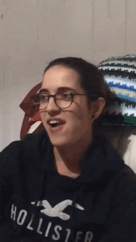 Young Woman Wearing Glasses And Hollister Sweatshirt GIF