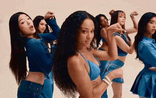Young Women Dancing, One in Blue Bra