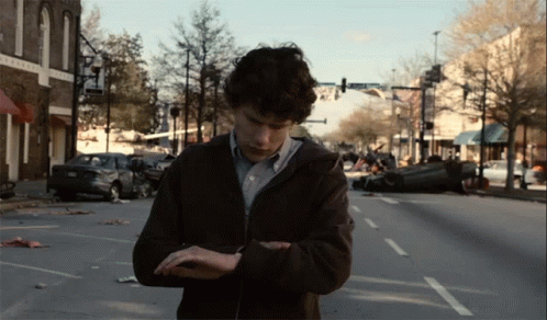 Zombieland Worried Jesse Eisenberg Check Watch GIF